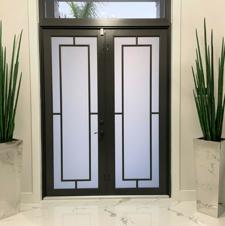 Stainless steel cube-shaped vase with snake grass.