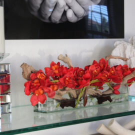 24″ Casa Moderna glass plate planter with red Cymbidiums