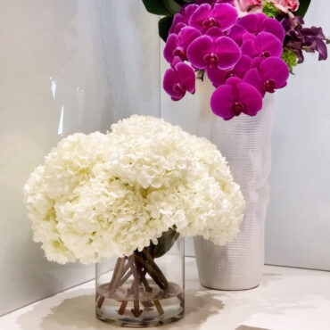 White Hydrangea Bouquet in clear glass cylinder vase